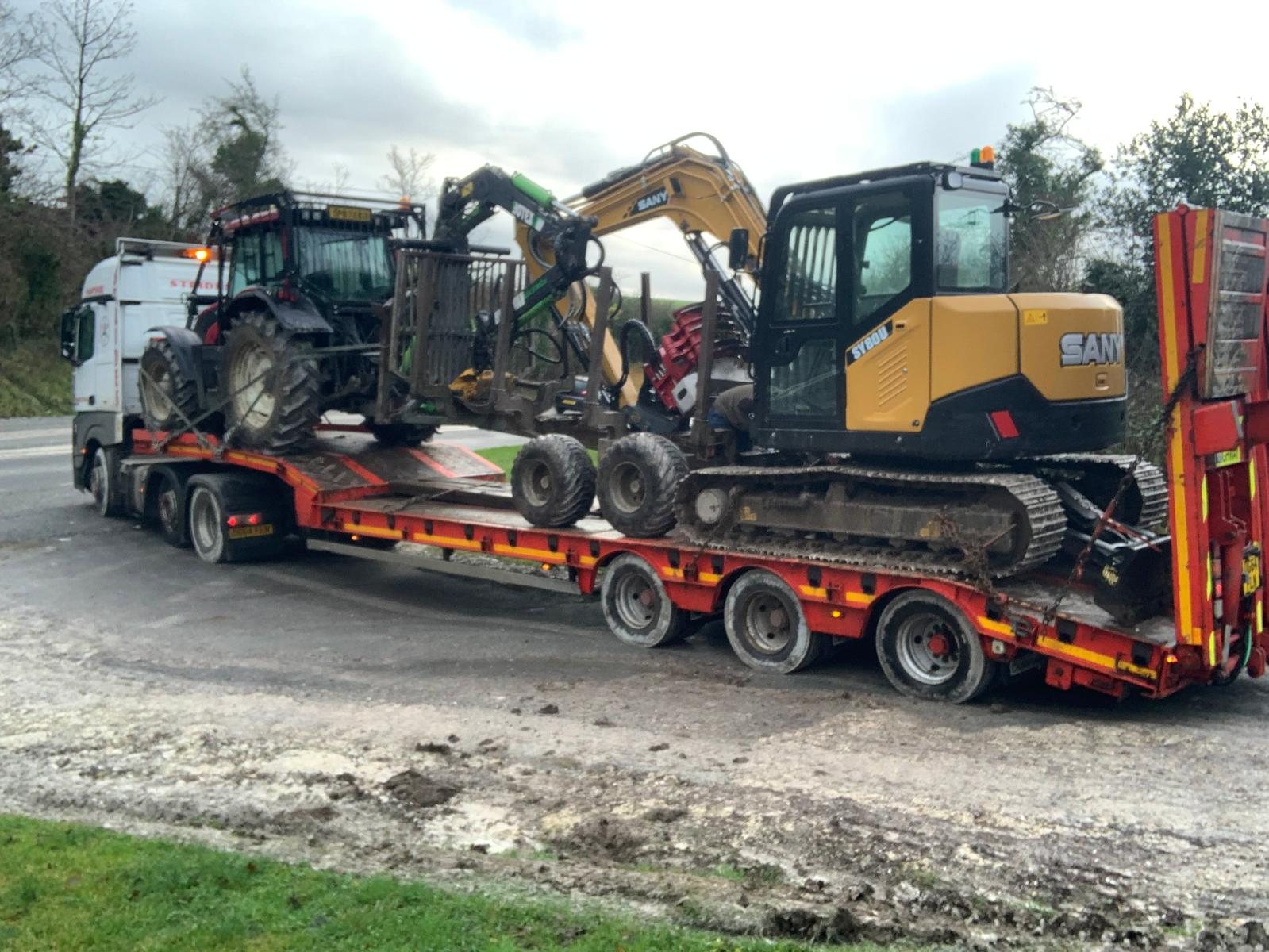 Forestry machinery secured on a transport trailer