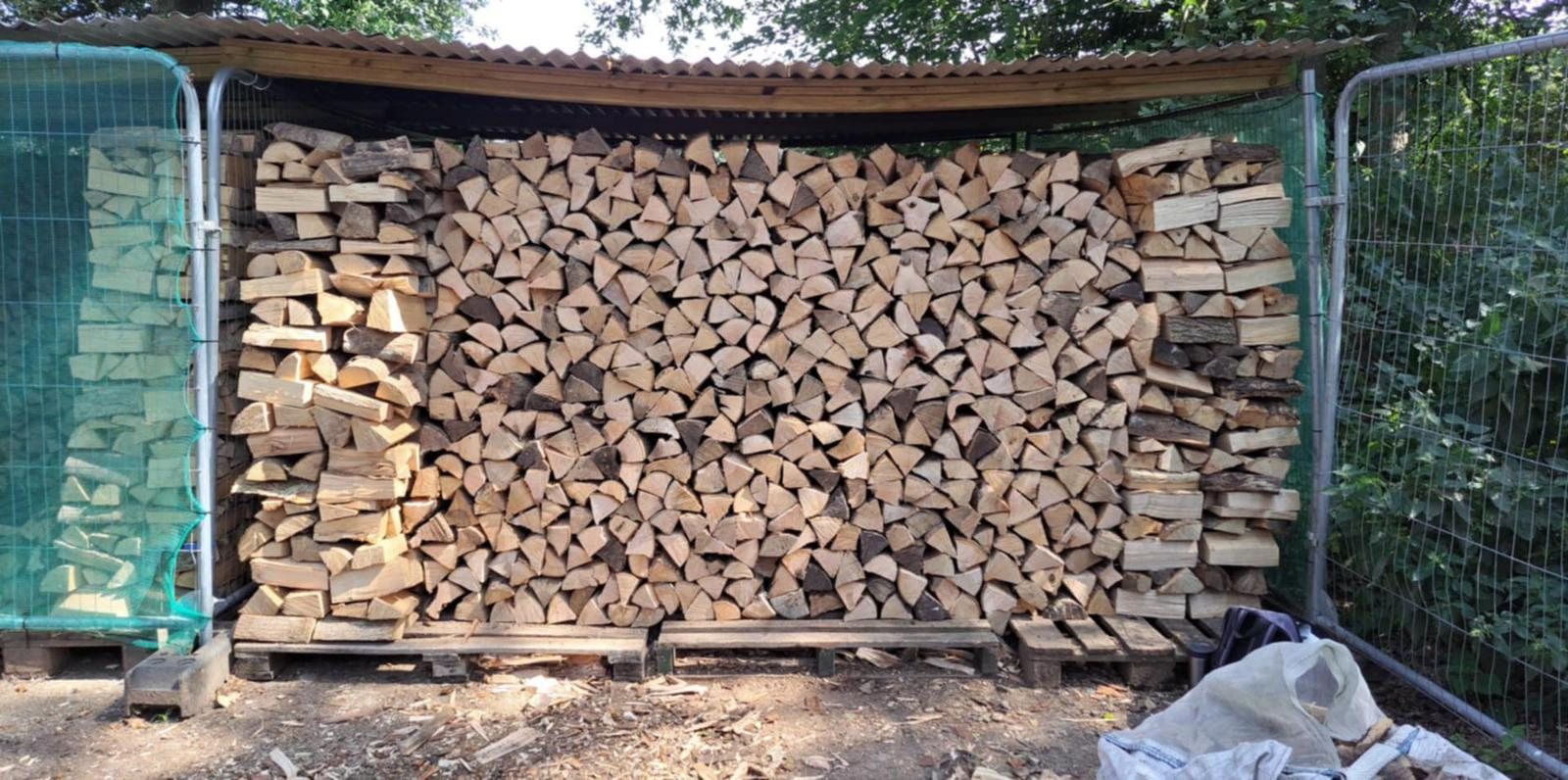 Split logs stacked in a covered store
